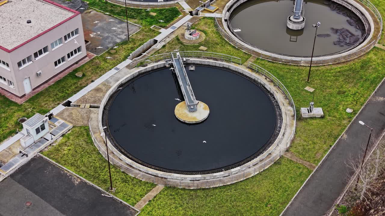 Water treatment facility with large circular tanks in view