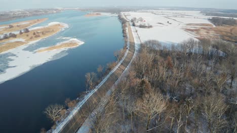 beautiful coastal road during cold winter season in aerial drone tilt view