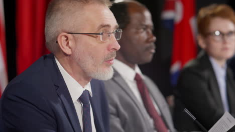 diplomat reading statement at press conference