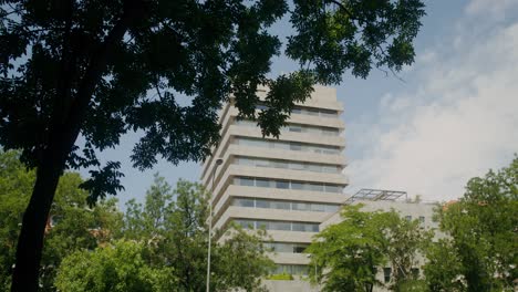 modern apartment building in a city park