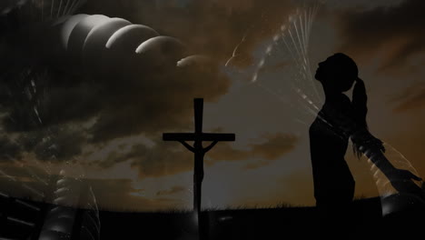 praying beside cross, silhouette under celestial animation scene with abstract sky