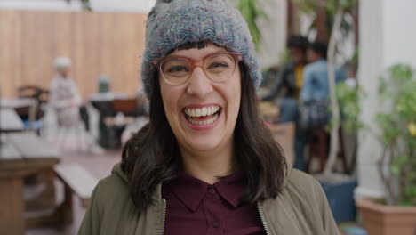 portrait of happy hipster woman wearing funky glasses laughing cheerful looking at camera