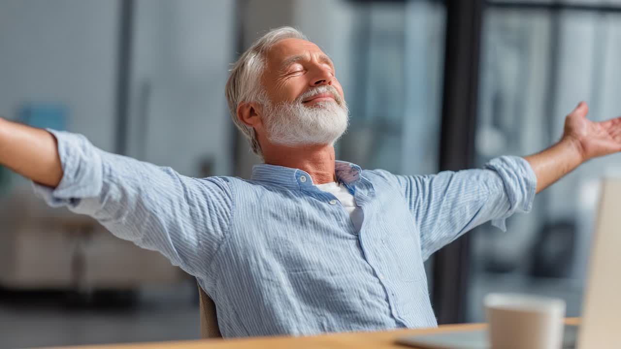 A Contented Senior Man Enjoys a Moment of Peace and Relaxation with Eyes Closed, Embracing Calmness in a Bright and Comfortable Space