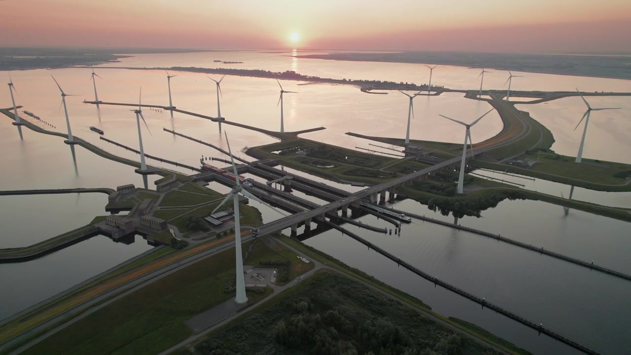 Majestic View Of Windpark Krammersluizen During Golden Hour In Bruinisse, The Netherlands. Aerial, wide shot
