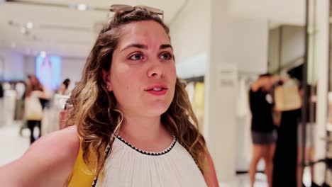 young woman shopping in modern clothing store