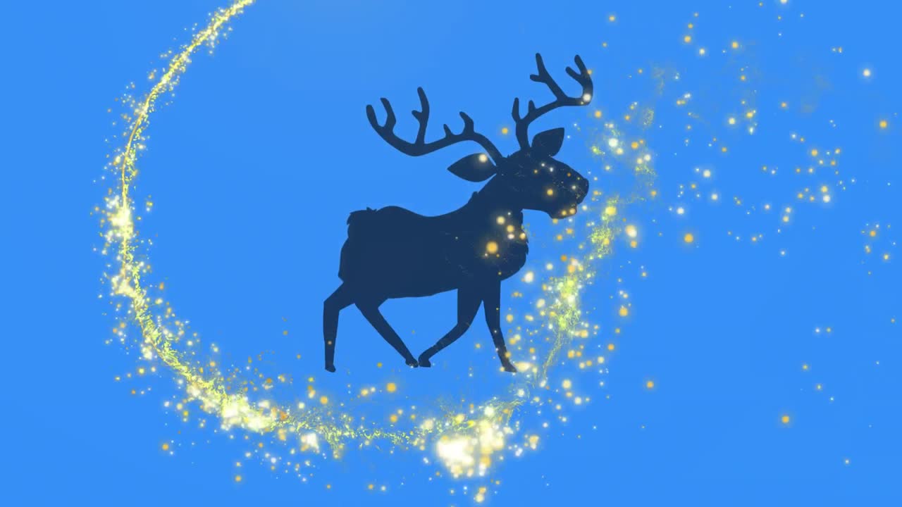 estrella fugaz dorada sobre la silueta de renos caminando contra un fondo azul