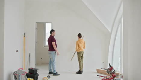 father and son working together on home improvement project