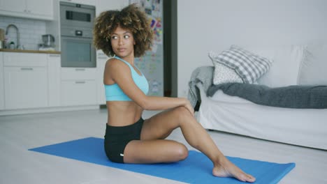 Woman-stretching-body-training-on-mat