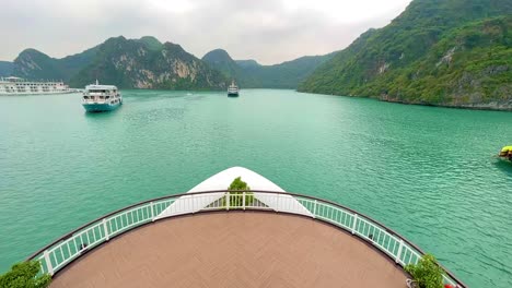 looking out from top of cruise ship out to ha long bay and lan ha bay heritage area in vietnam with limestone karsts