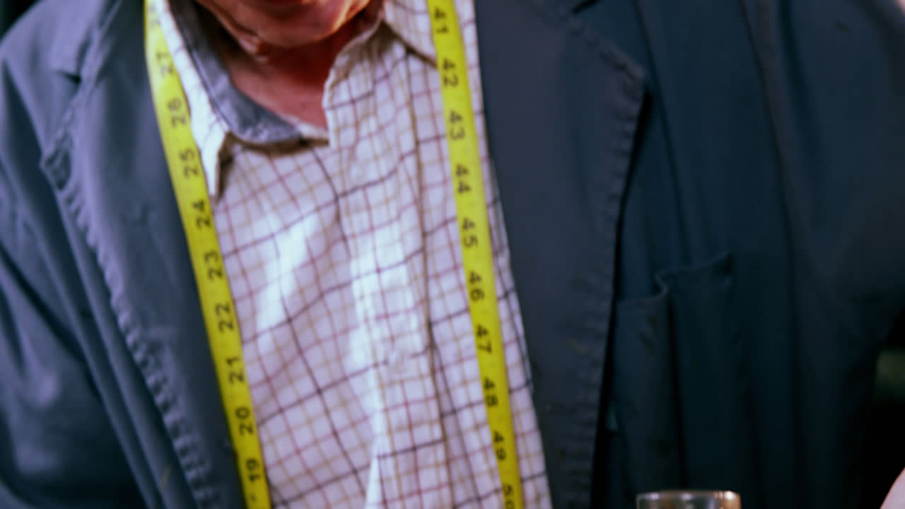 Shoemaker hammering on a shoe