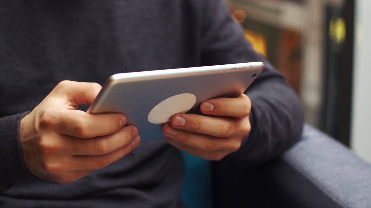 Person holding a tablet