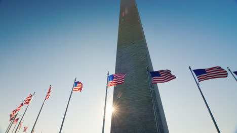 sun behind washington monument