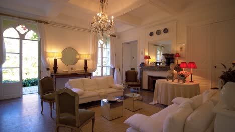 interior view of the living room area with chairs and seat lounges in modern castle in southern france