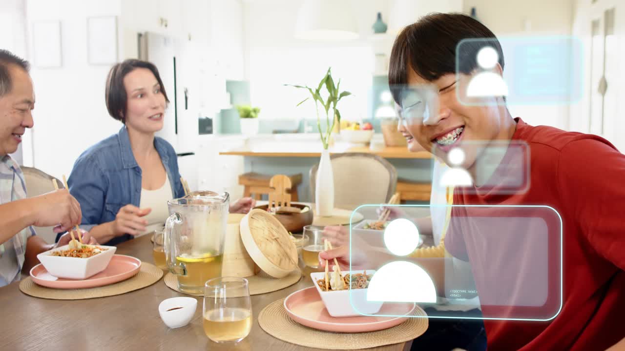 Family dining on noodles while camera shifting and revealing AR icons over red diner, tech demo