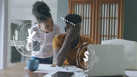 animation of currency icons data processing over worried african american couple paying bills