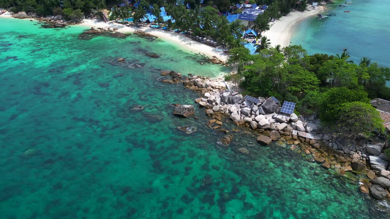 tropical island resort using solar panels to generate green energy