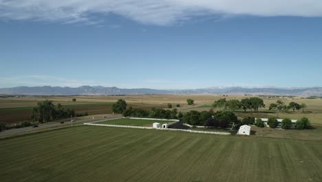 rocky mountains provide the perfect backdrop for this farmhouse