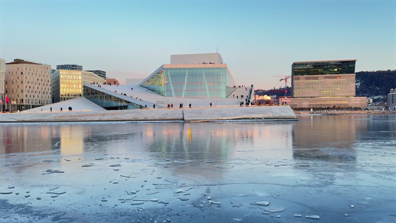 Oslo Opera House Norway Operahuset Norge aerial drone Norwegian Inner Oslo Fjord arctic vibrant golden hour sunset downtown cityscape sauna icy frozen sea ocean breeze Munch Museum skybar pan left