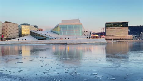 oslo opera house norway operahuset norge aerial drone norwegian inner oslo fjord arctic vibrant golden hour sunset downtown cityscape sauna icy frozen sea ocean breeze munch museum skybar pan left