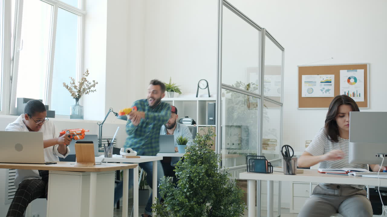 Office Team Fun with Water Guns