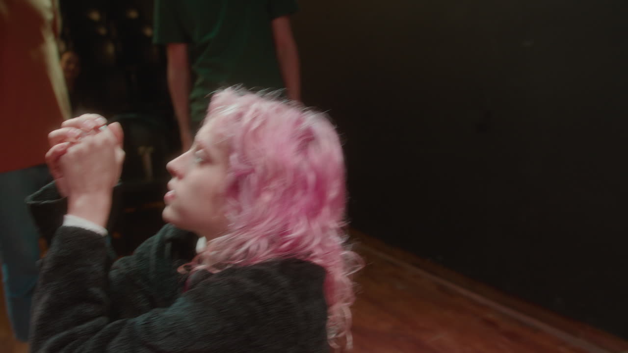 Dramatic Actress Improvising on Theater Stage during Acting Class