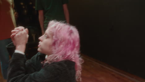 dramatic actress improvising on theater stage during acting class
