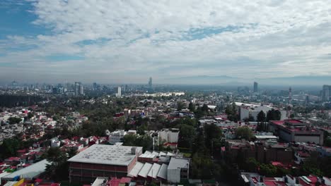 LANDSCAPE-OF-A-CITY-WITH-A-DRONE-THE-BLUE-SKY-AND-WITH-CLOUDS