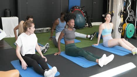 Group Stretching Session in a Fitness Center