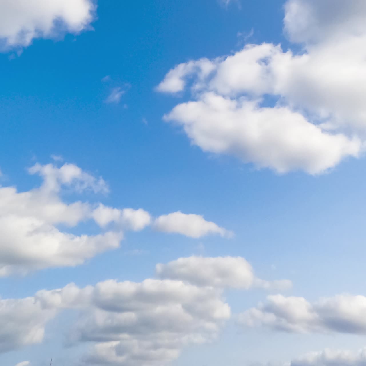 Summer sky motion of cloudscapes. Light clouds on blue bright sky