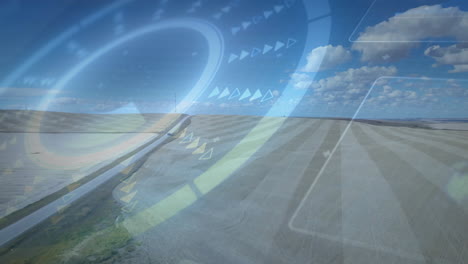 striped farmland stretching toward horizon while angled road running through animated hud overlay