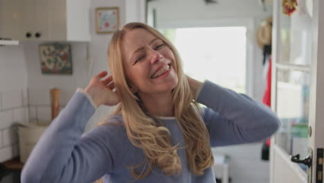 a happy woman in a kitchen