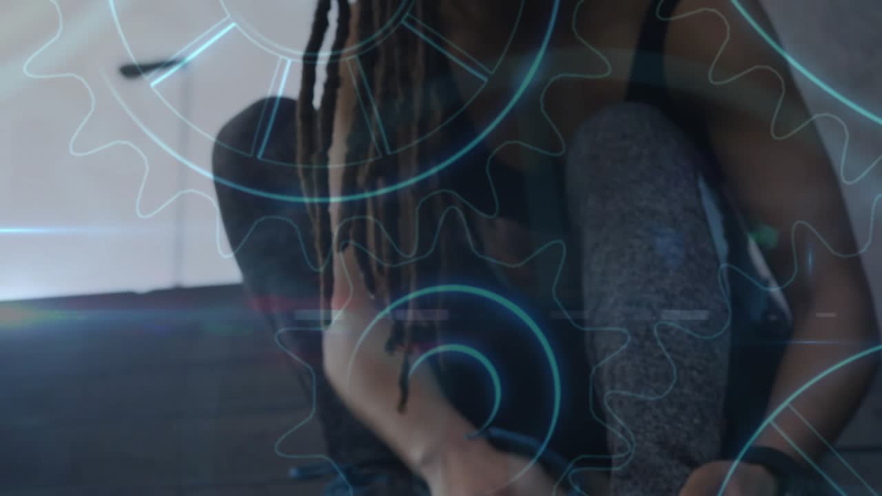 Woman reaching for lace tying shoes readying to move, blue gear graphics over shoes for fitness