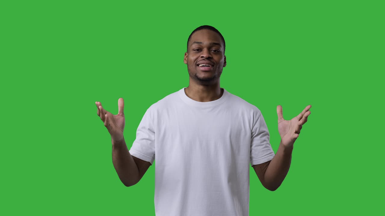 Man vlogging over green background