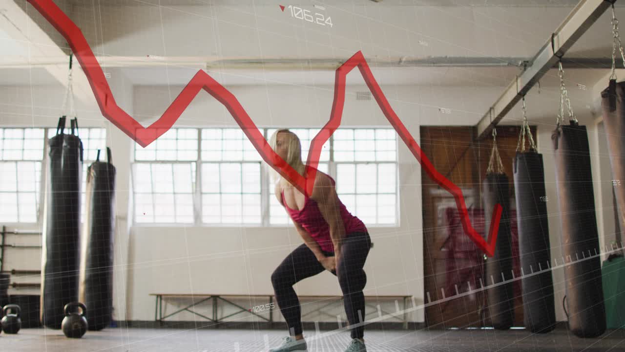 Woman lowering kettlebell overhead, hinging and swinging while red overlay tracing form for fitness