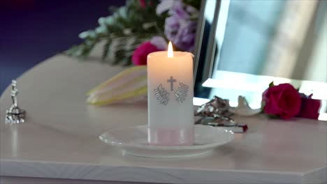 Shot-of-Flower-and-candle-used-for-a-funeral