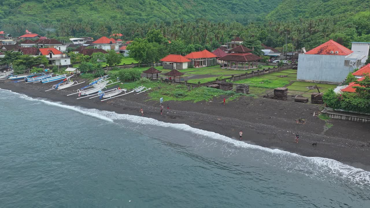 Aerial view of amed black sand beach in bali