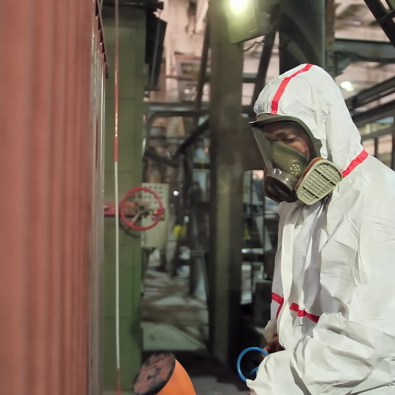 Man holding powder coating sprayer