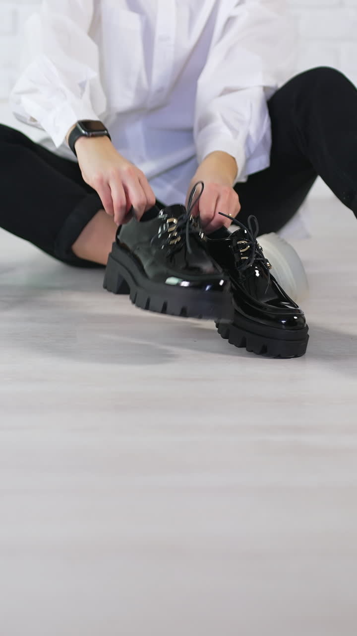 Girl choosing footwear shopping. Young lifestyle woman lifestyle choice. Vertical video