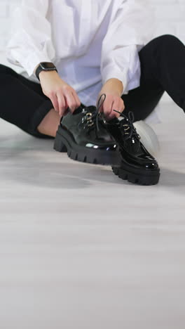 girl choosing footwear shopping. young lifestyle woman lifestyle choice. vertical video