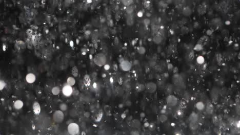 abstract dark background with white bokeh particles