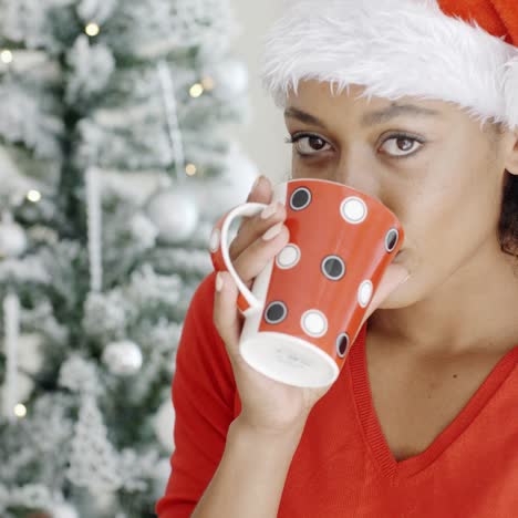 Young-girl-enjoying-coffee-on-Christmas-Day
