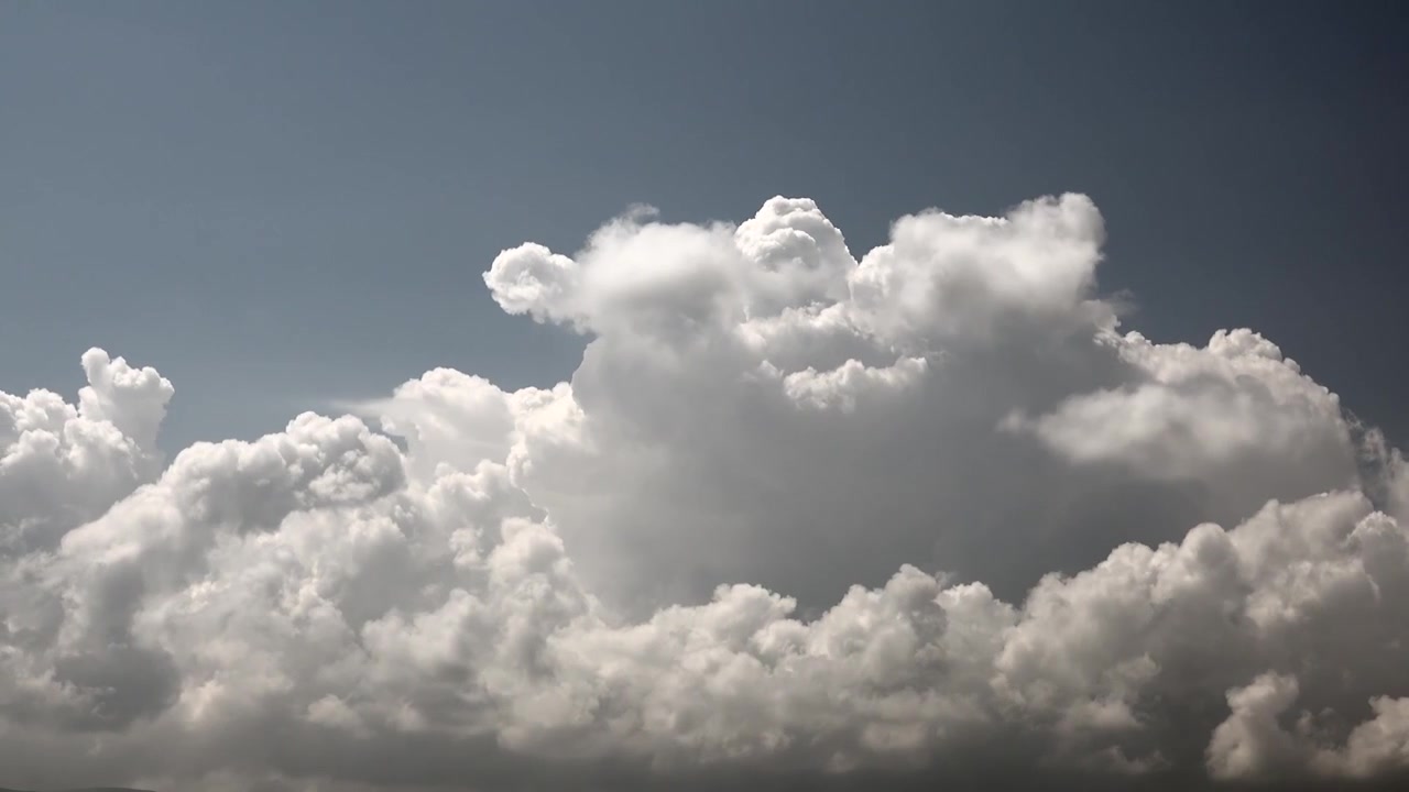Time Lapse of Fluffy White Cumulus Clouds Moving Across Blue Sky