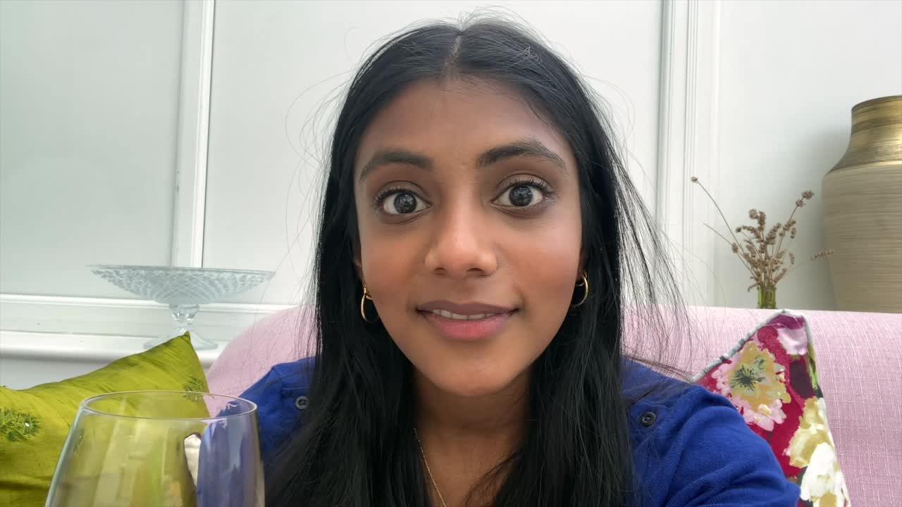 Asian Woman Receiving Good News Video Call