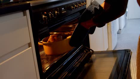 father watching the cooking of the chicken 4k