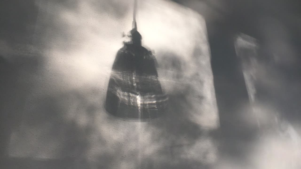Abstract Wall with Moving Shadows and Lampshade