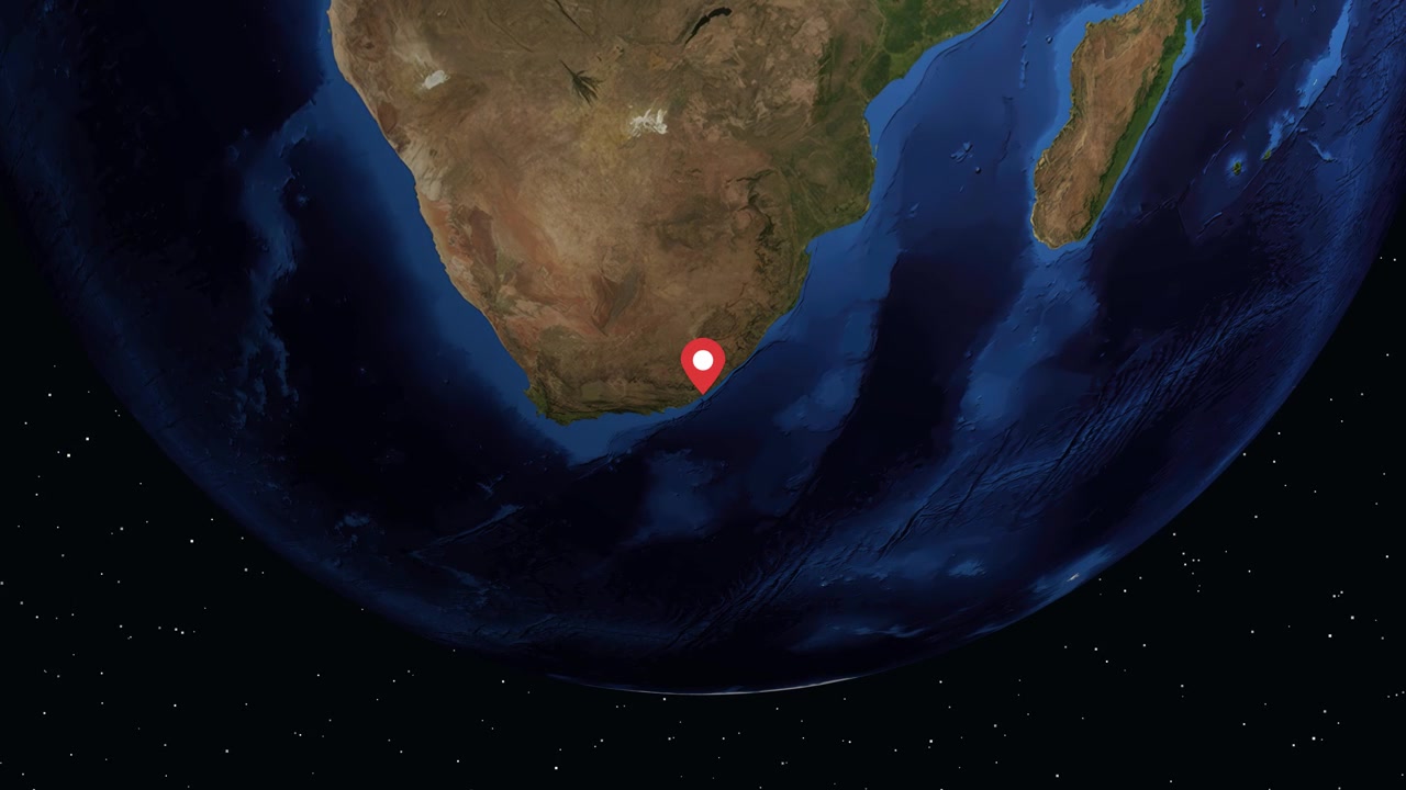 Digital globe rotates and zooms into South Africa, displaying location markers and regional demographic information