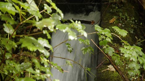 Close-up-shot-of-Rainwater-being-funnelled,-controlled-under-the-platform-at-Cynonville-Station