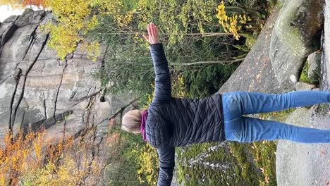 a Woman Enjoys the Autumn Nature she Looks at the Rocky Stone Mountains a Feeling of Connection with a Woman Enjoys the Autumn Nature she Looks at the Rocky Stone Mountains a Feeling of Connection with Nature