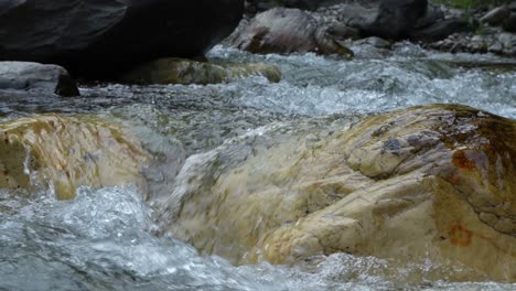 water is flowing through a mountain torrential river.