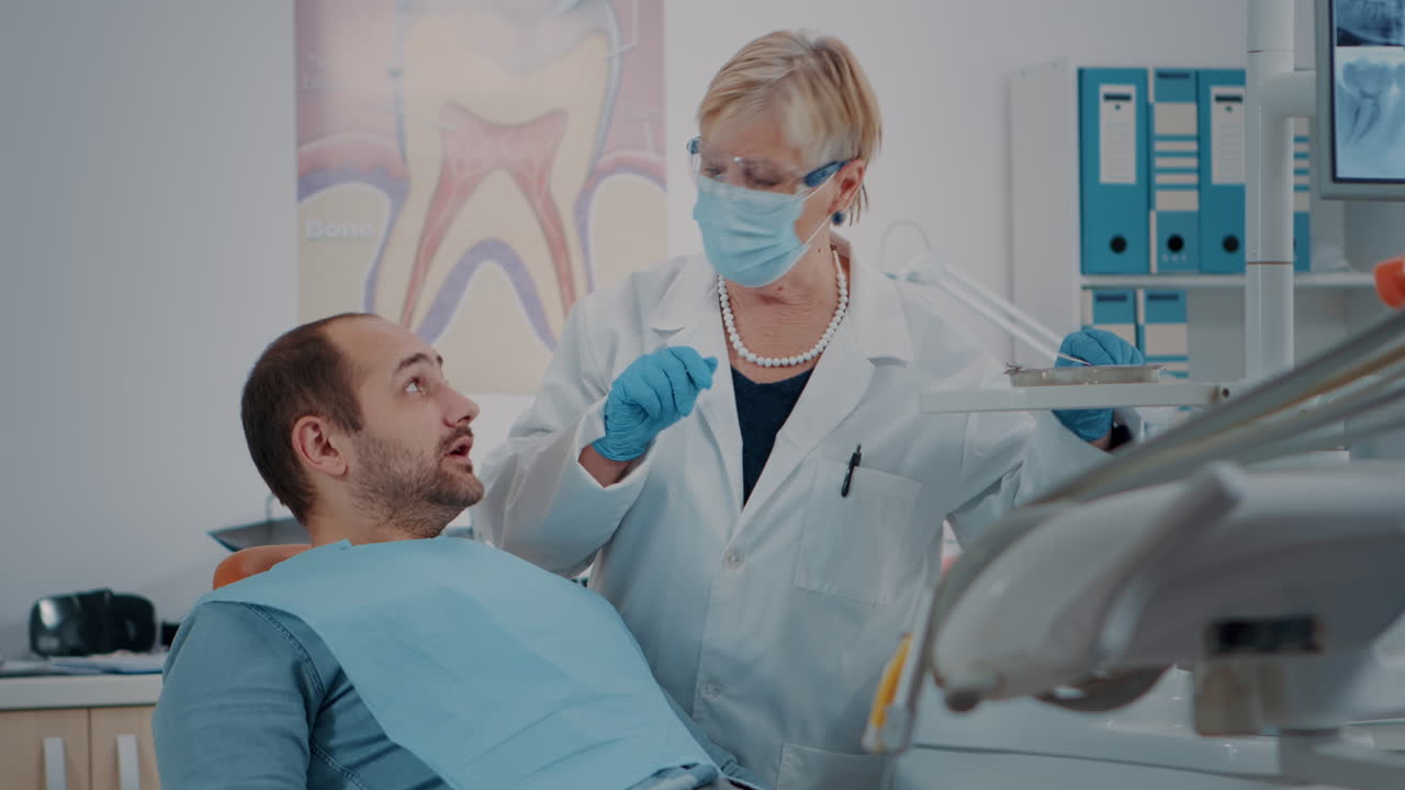 Oral care medic using dental tools to do teeth examination